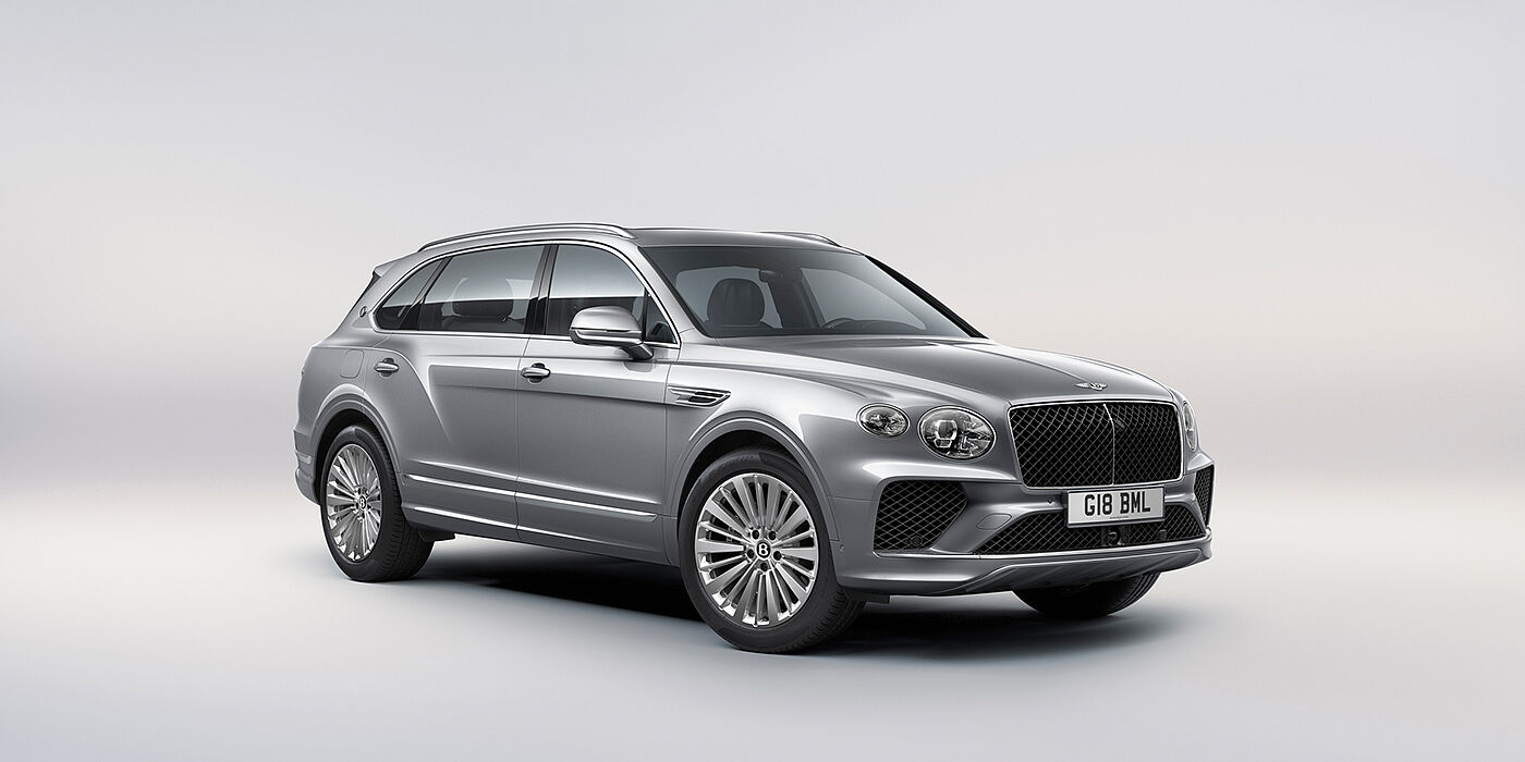 Bentley Muscat Bentley Bentayga Extended Wheelbase luxury SUV front three quarter view in Moonbeam paint with 21 inch five spoke painted wheels
