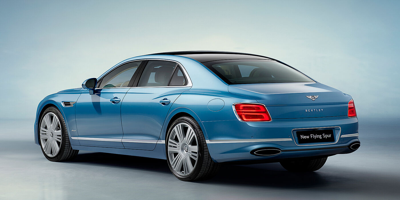 Bentley Muscat New Bentley Flying Spur Azure sedan rear view in Light windsor blue by Mulliner paint with 22 inch Azure wheels and chrome exterior details