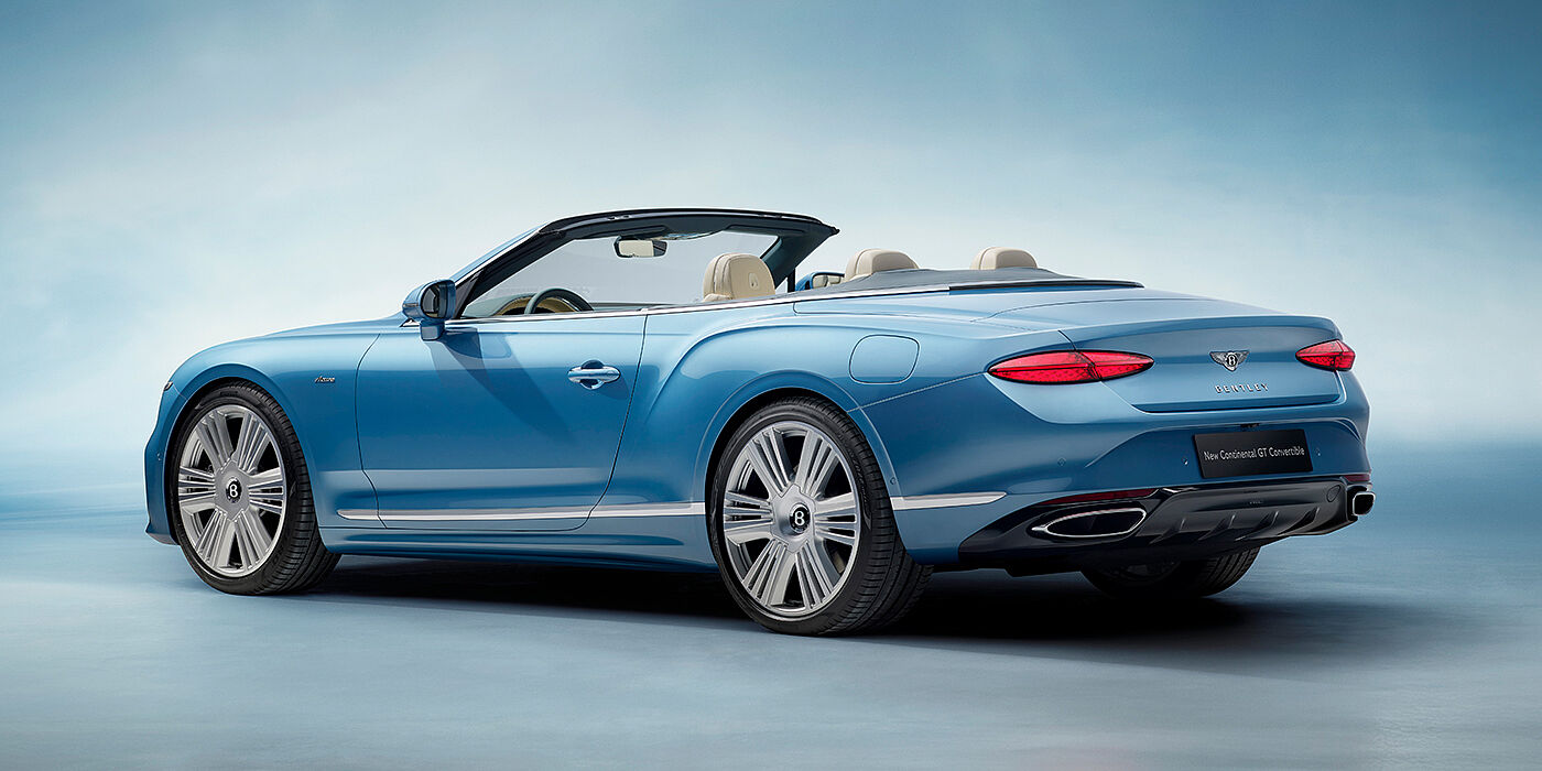Bentley Muscat New Bentley Continental GTC Azure convertible rear view in Light Windsor blue paint with 22 inch ten spoke wheels and chrome exterior details