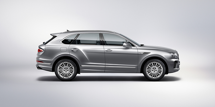 Bentley Muscat Bentley Bentayga SUV side profile in Moonbeam silver paint against white background featuring 21 inch 5 spoke wheels