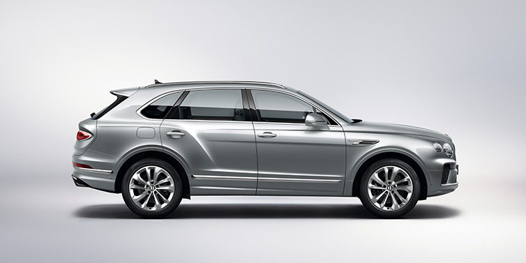 Bentley Muscat Bentley Bentayga SUV side profile in Moonbeam silver paint against white background