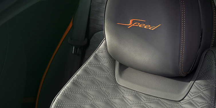 Bentley Muscat Bentley Continental GT Speed coupe seat detail in Gravity Grey hide and Speed emblem in Mandarin by Mulliner coloured embroidery