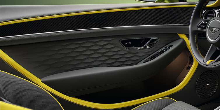 Bentley Muscat Bentley Continental GTC Speed convertible interior door details featuring Gravity Grey and Cyber Yellow by Mulliner hides and high gloss carbon fibre veneer