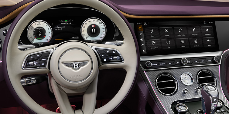 Bentley Muscat Bentley Continental GTC Mulliner convertible steering wheel and drivers screens surrounded by Damson purple and Linen hides